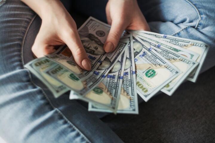 How Much Cash Should You Hold? The Opportunity Cost of Liquid Assets